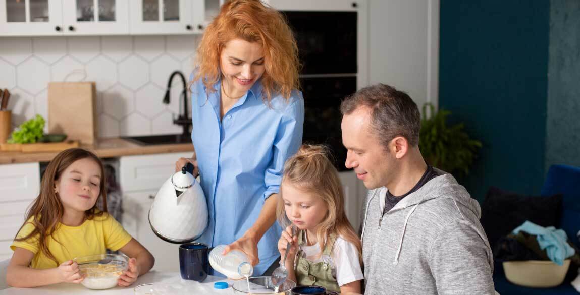 Australian host family sitting in their kitchen
